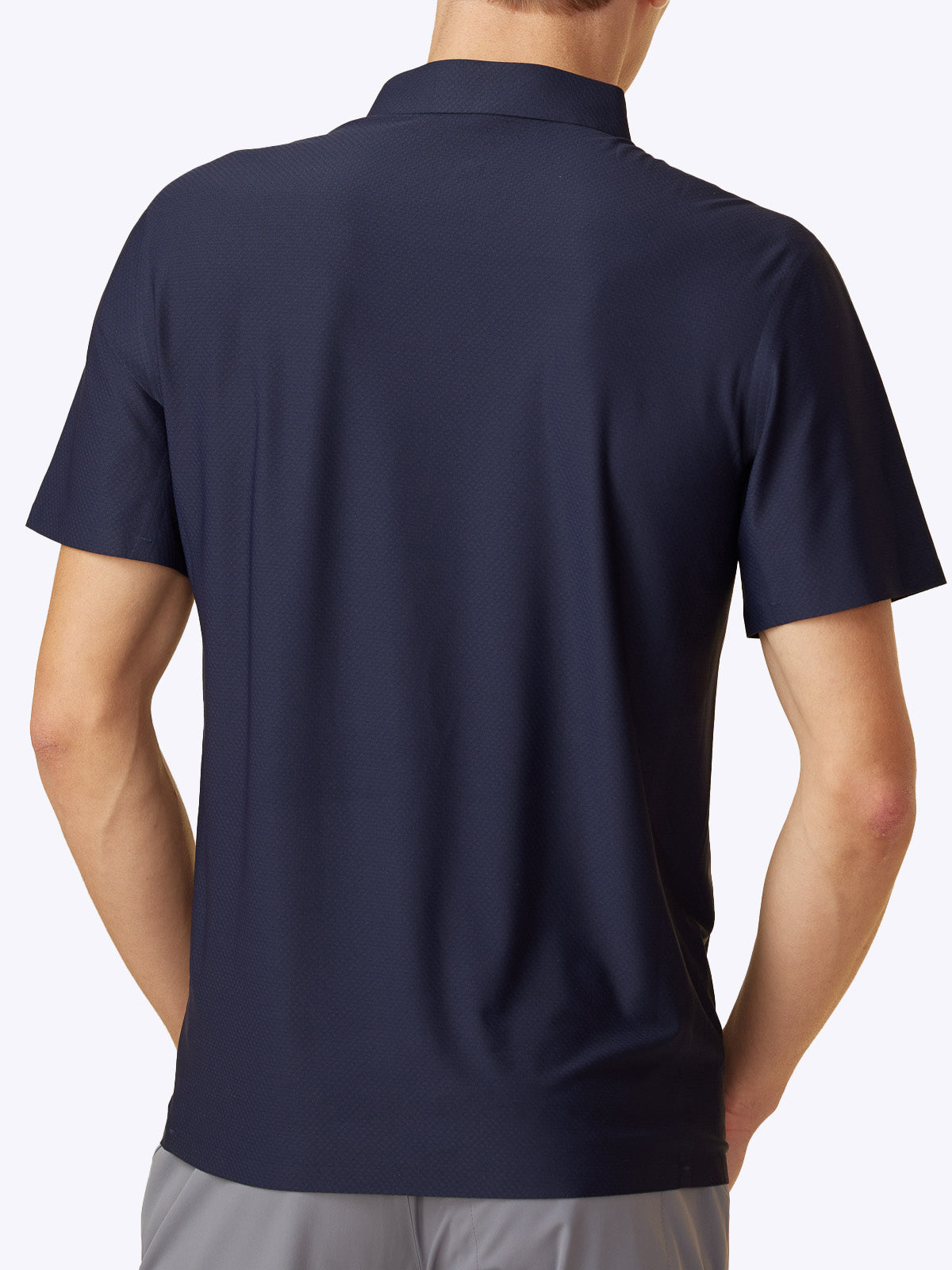 Rear view of the Loogaroo Gameday Polo in Oceana, illustrating the shirt's elegant back design and texture||||Oceana