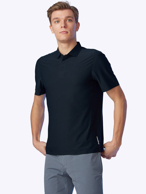 Model displaying the Loogaroo Gameday Polo in Onyx, front view highlighting its sleek black design.