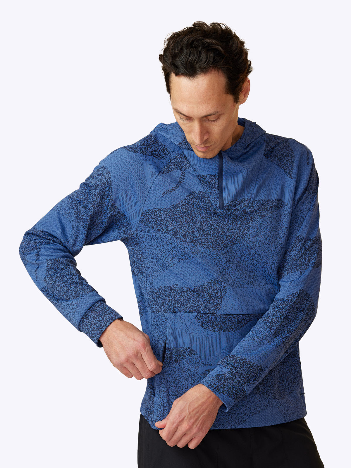 Side profile of Loogaroo Pulse Hoodie in Oceana, revealing the hoodie's sleek design and pocket detail||||Oceana
