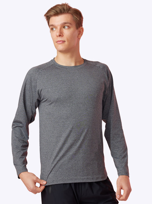 Model wearing Loogaroo Seamfinity Long Sleeve in Charcoal, front view showcasing fit and style 