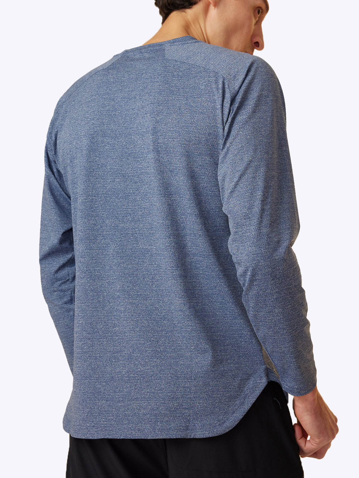 Side view of the Seamfinity Long Sleeve in Indigo Navy, highlighting the luxurious fabric and fit||||Indigo Blue