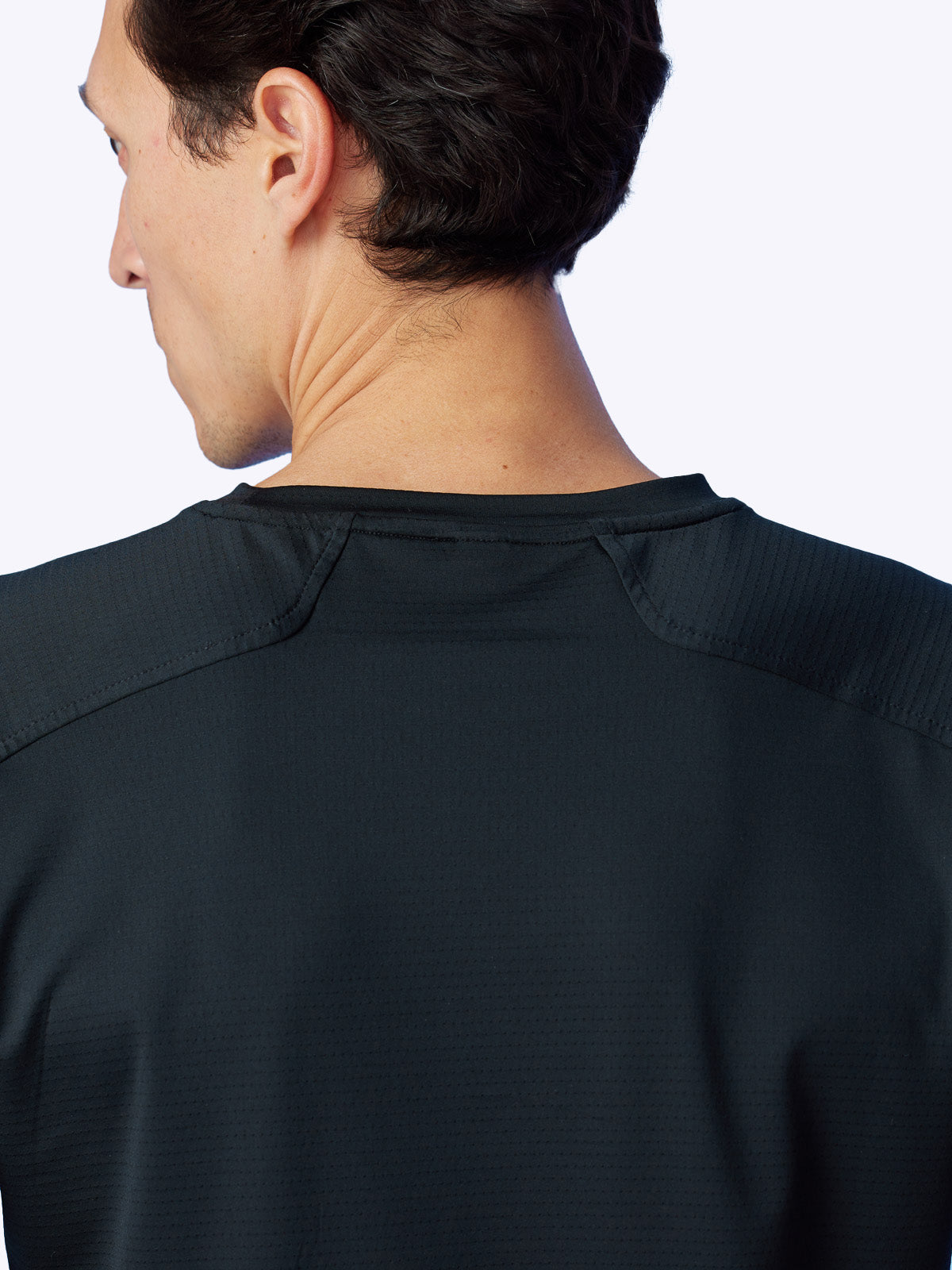 Rear shot of the Seamfinity Long Sleeve in Onyx, showcasing the garment's elegant design and performance quality||||Onyx