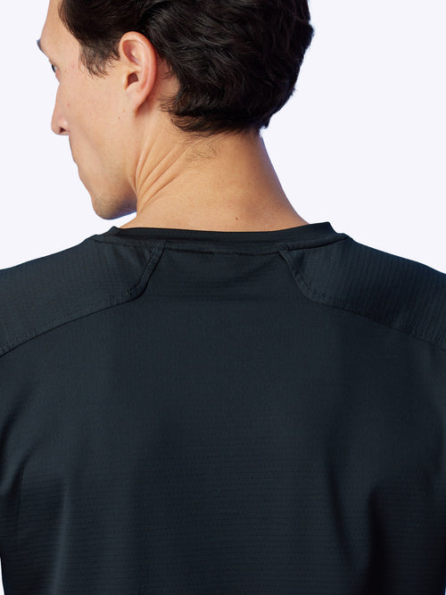 Rear shot of the Seamfinity Long Sleeve in Onyx, showcasing the garment's elegant design and performance quality