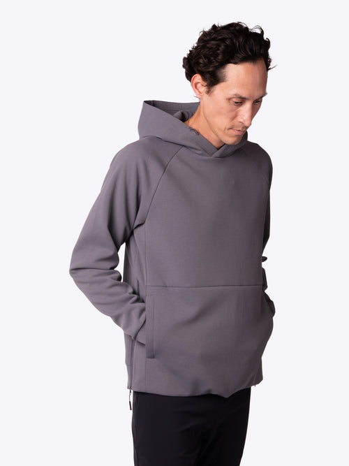 Loogaroo model wearing a Charcoal MoonWeave Hoodie, side view, athletic wear